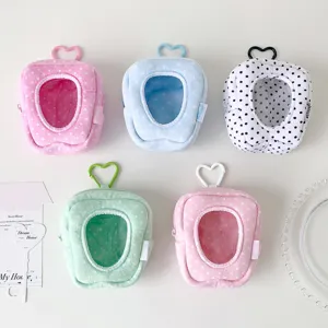 Five colorful tooth-shaped plush doll storage bags with clear display windows and heart clips.