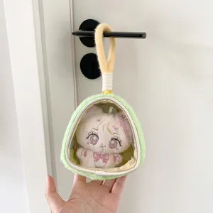 Detail of plush doll display bag with transparent window hanging on a door