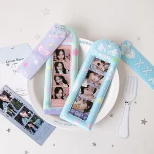 Detailed view of pastel PVC four-grid photocard holders with cute angel wing charms