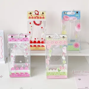 Detailed view of four cute cake-themed transparent PVC display bags for cotton dolls