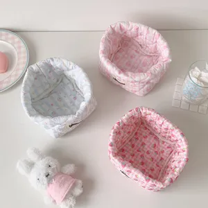 Set of three cute quilted fabric storage baskets with floral and checkered patterns