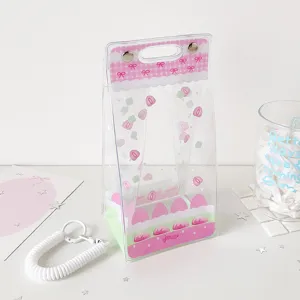 Close-up detail of the cute pink cake theme transparent PVC doll display and storage bag
