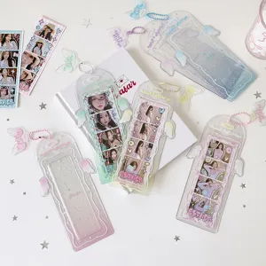 Detailed view of angelic wing photo sleeves for storing four-frame idol pictures.