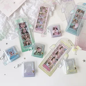 Detail view of sparkly angel wing photocard holders and mini album keychains