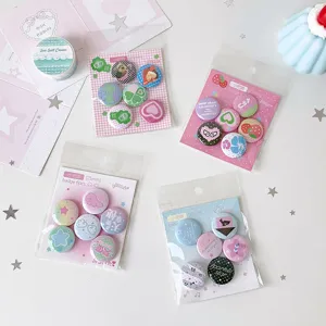 Detail showing four sets of 25mm mini cute cartoon pin badges for backpack decoration