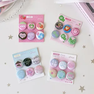 Four sets of 25mm kawaii mini badge pins with cute cartoon patterns for DIY decor