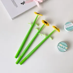 Top-down detail of sunflower-shaped gel pens with green stems and yellow petals.