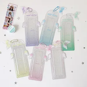 Glittery angel wing acrylic photocard holders in multiple pastel colors with chains