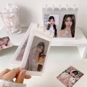 Transparent 3-inch PP photocard album displayed on a white desk with celebrity idol cards