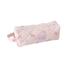 Trousse à crayons rose matelassée avec nœud et poignée de transport