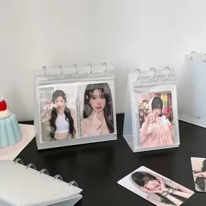 Detailed view of transparent PP desktop photo album displaying K-pop idol photocards