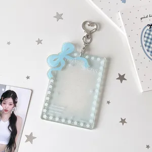 Porta fotocard in acrilico glitterato con fiocco blu e portachiavi a cuore per foto