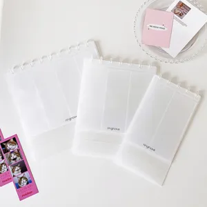 Detailed view of three sizes of transparent mushroom-bound photo albums for 4-grid photos