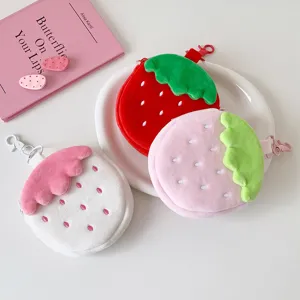 Collection of cute plush strawberry coin purses in red, pink, and white colors