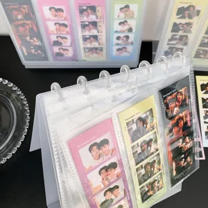 Close-up of a desktop photo album collector for four-cut photos with mushroom rings