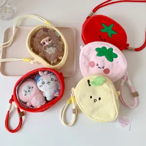 Collection of colorful fruit-shaped plush display bags with clear windows for dolls