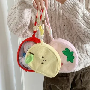 Detailed view of plush doll display bags in yellow, red and pink colors