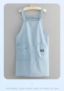 Light blue solid color apron with dual pockets, lightweight and waterproof for cooking.