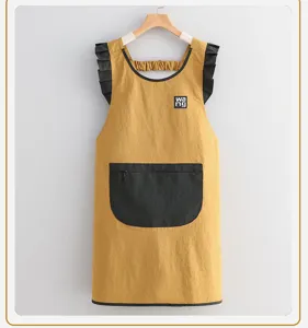 Stylish yellow kitchen apron with black ruffles and zipper pocket for cooking and baking