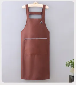 Solid color waterproof cooking apron with large pocket, durable work apron for home kitchen.