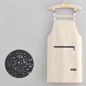 Waterproof oilproof kitchen apron with large pocket and adjustable straps for daily cooking use.