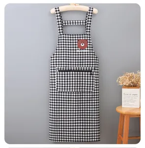 Black and white plaid kitchen apron with zipper pocket and cute bear patch for home cooking.