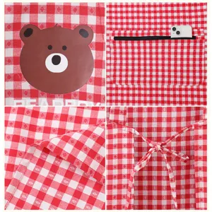 Red and white checkered kitchen apron with cute cartoon bear print and zipper pocket.