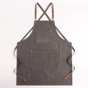 Grembiule da cucina spesso in tela con bretelle incrociate e tasche per cucina, giardino e bar.