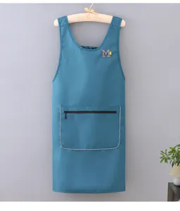 Detailed view of the sleeveless waterproof kitchen apron in blue with pocket and M patch.