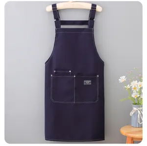 Durable canvas apron for adults, sleeveless design with shoulder straps, perfect for kitchen and work.