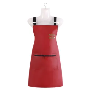 Red PU leather waterproof apron for kitchen, cooking, baking and work use with handy zip pocket.