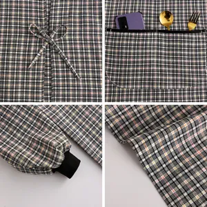Long sleeve kitchen cooking apron with pockets and plaid design for comfortable daily wear.