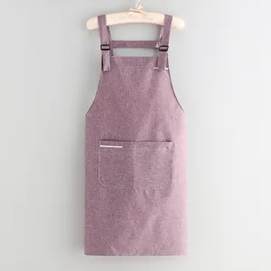 Stylish purple kitchen apron with pockets and adjustable straps, perfect for home cooking.