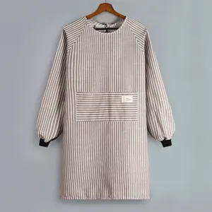 Long sleeve striped apron for kitchen cooking, household smock with front pocket and cotton linen fabric.