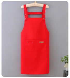 Detailed view of the vibrant red poly-cotton work apron, featuring waterproof design and pockets.