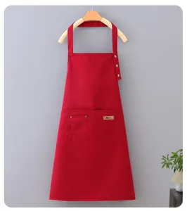 Red waterproof work apron with pockets and buttons, ideal for kitchen cooking and coffee shop use.