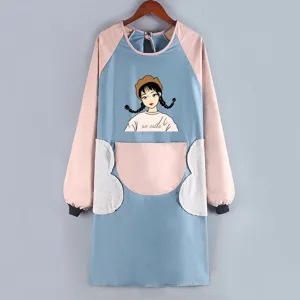 Detailed view of the long sleeve waterproof kitchen apron with cute cartoon girl print and pockets.