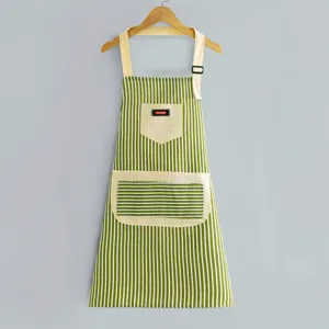Green and white striped cotton apron for kitchen cooking and housework with adjustable straps.