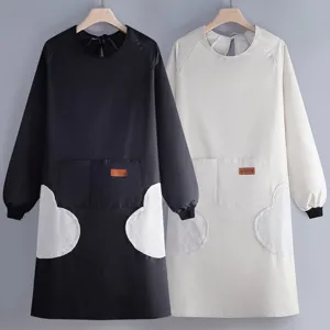 Long sleeve waterproof kitchen apron with pockets, oil-resistant work smock for cooking.
