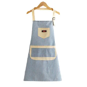 Cotton linen blue striped kitchen apron with adjustable neck strap and pockets for home cooking.