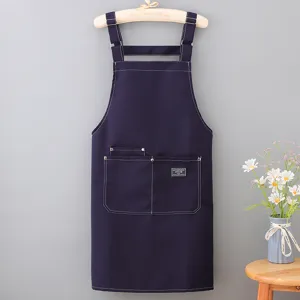 Customizable canvas apron for adults, sleeveless workwear with pockets and contrast stitching.