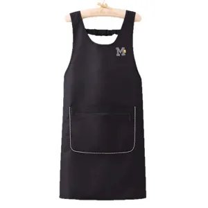 Waterproof sleeveless kitchen apron in black with front pocket and letter M embroidery.
