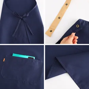 Tablier de travail en coton bleu foncé avec bretelles réglables et grande poche pour supermarché.
