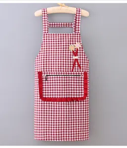 Detailed view of a red grid cotton kitchen apron with ruffled zipper pocket and cute flower.