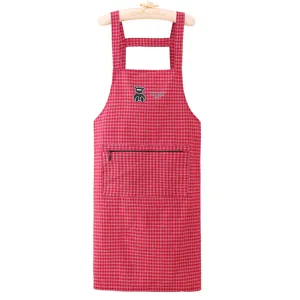 Red and white checkered kitchen apron with pocket, comfortable cotton workwear for cooking.