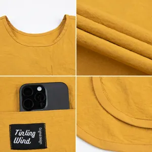 Delantal de trabajo amarillo con bolsillo práctico y diseño de cintura, tela cómoda.