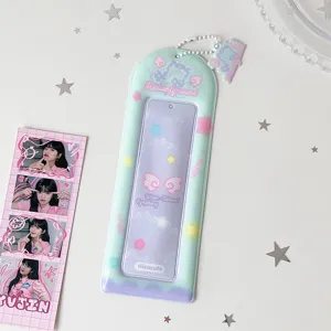 Close-up of pastel PVC four-frame photo card holder with a matching charm