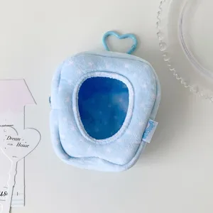 Close-up detail of a blue star-patterned plush doll display bag featuring a heart hook.