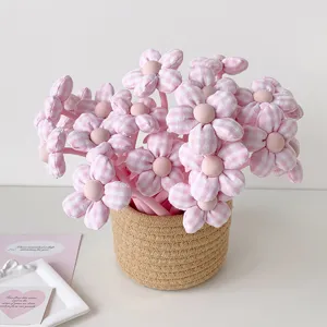 Charming handmade pink gingham fabric flower gift pens arranged in a woven basket