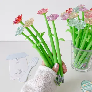 Beautiful creative crystal rose-shaped gel ink pens held in hand for cute stationery gift